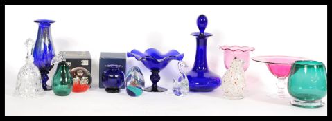A good collection of Bristol Blue glass to include decanters, glasses in blue and cranberry glass,