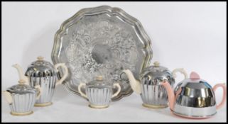 A mid century Heatmaster silver plated and ceramic tea service set comprising teapot, coffee pot,