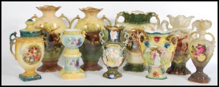 A selection of 19th century Staffordshire pairs of vases to include a pair featuring Clyde deer with