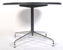 AFTER CHARLES AND RAY EAMES A CONTEMPORARY ROUND DINING TABLE