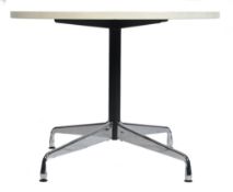 AFTER CHARLES AND RAY EAMES A CONTEMPORARY ROUND DINING TABLE