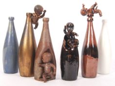 Sylvia Morris ( British 20th century ) A collection of studio art pottery bottle vases, 4 adorned
