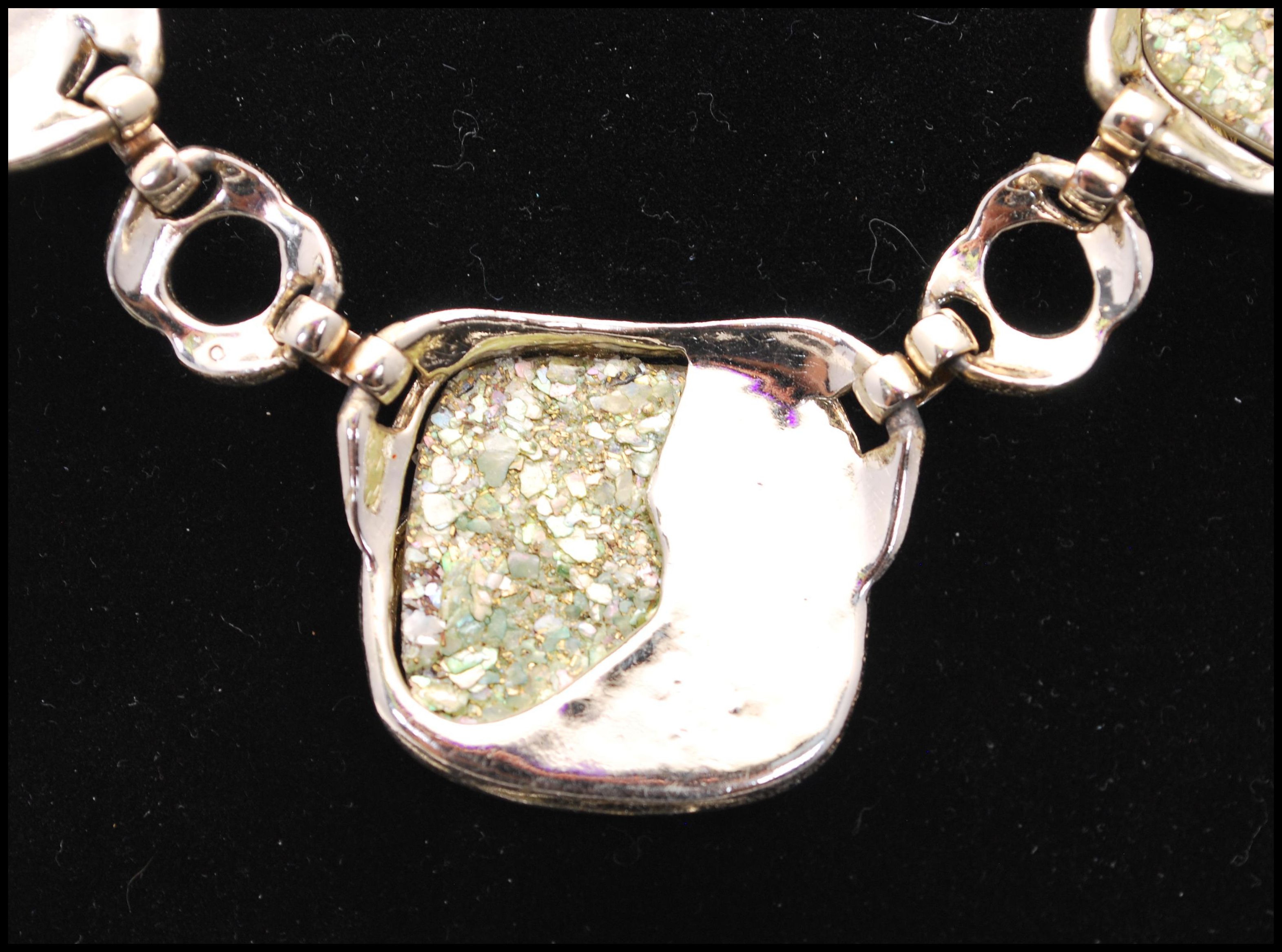 A 1950s silver-tone confetti lucite demi parure consisting of necklace earrings and bracelet. - Image 3 of 8