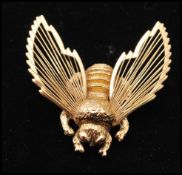 A 1970s signed Monet Bumble Bee brooch pin. Measures 1 1/2 inches.