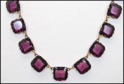 A 1920s Czech riviere necklace strung with amethyst square cut glass crystals. Measures approx 15