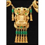 A vintage signed Askew of London gold-tone statement figural necklace with central Buddha.