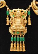 A vintage signed Askew of London gold-tone statement figural necklace with central Buddha.