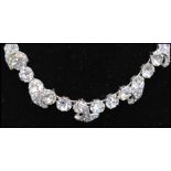 A signed Eisenberg demi parure consisting of rhinestone set necklace, earrings and bracelet.