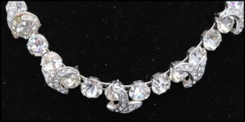 A signed Eisenberg demi parure consisting of rhinestone set necklace, earrings and bracelet.