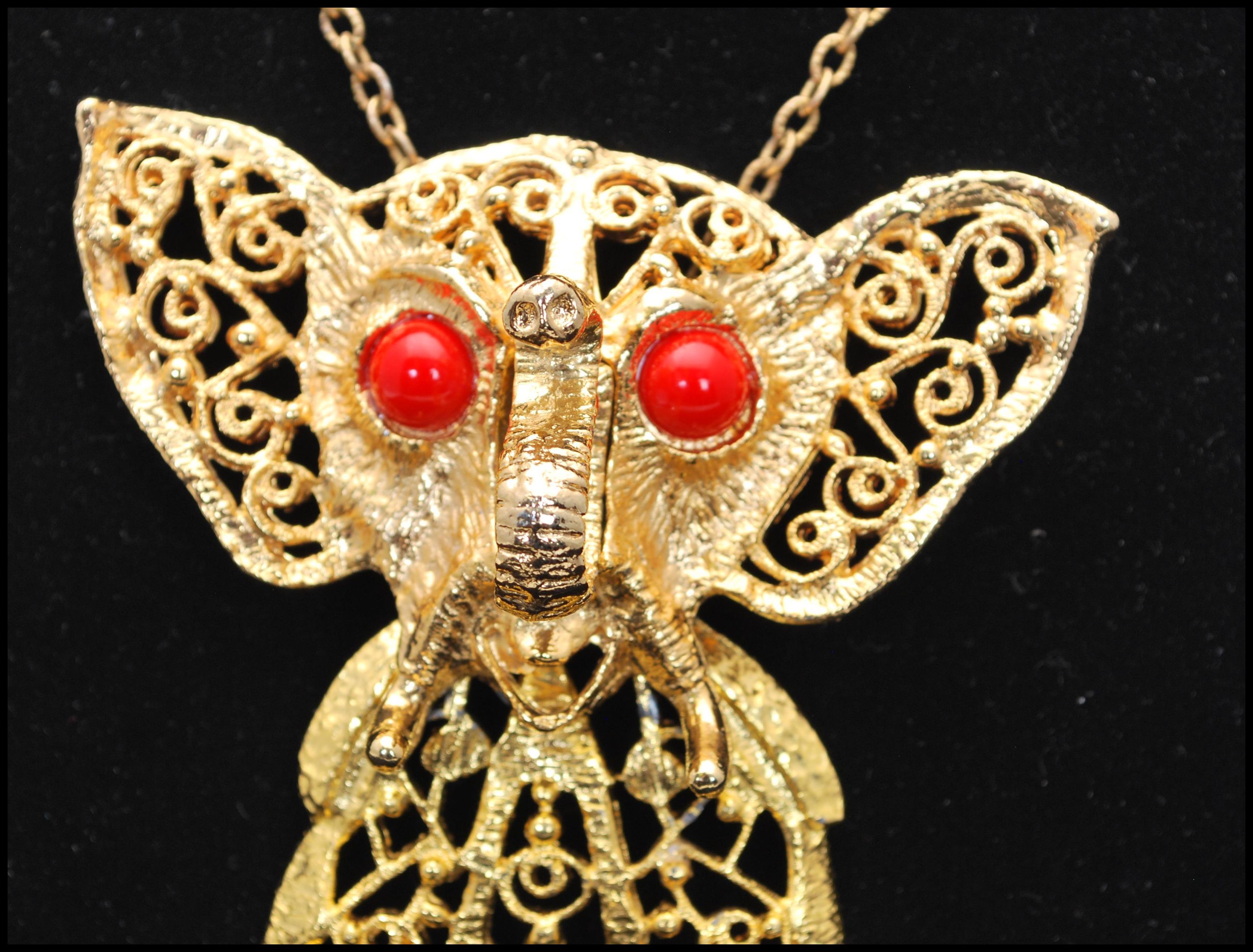 A vintage Delizza and Elster large articulated elephant pendant necklace having coral coloured - Image 2 of 6