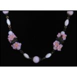 A 1920's vintage Czech pink glass bead flower necklace strung with pink lamp work flowers and