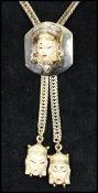 1950s Selro / Selini Asian Princess gold-tone lariat slide necklace and earring set consisting of  a