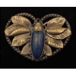 A 1930s Art Deco belt buckle set with an iridescent glass scarab beetle having rhinestone eyes