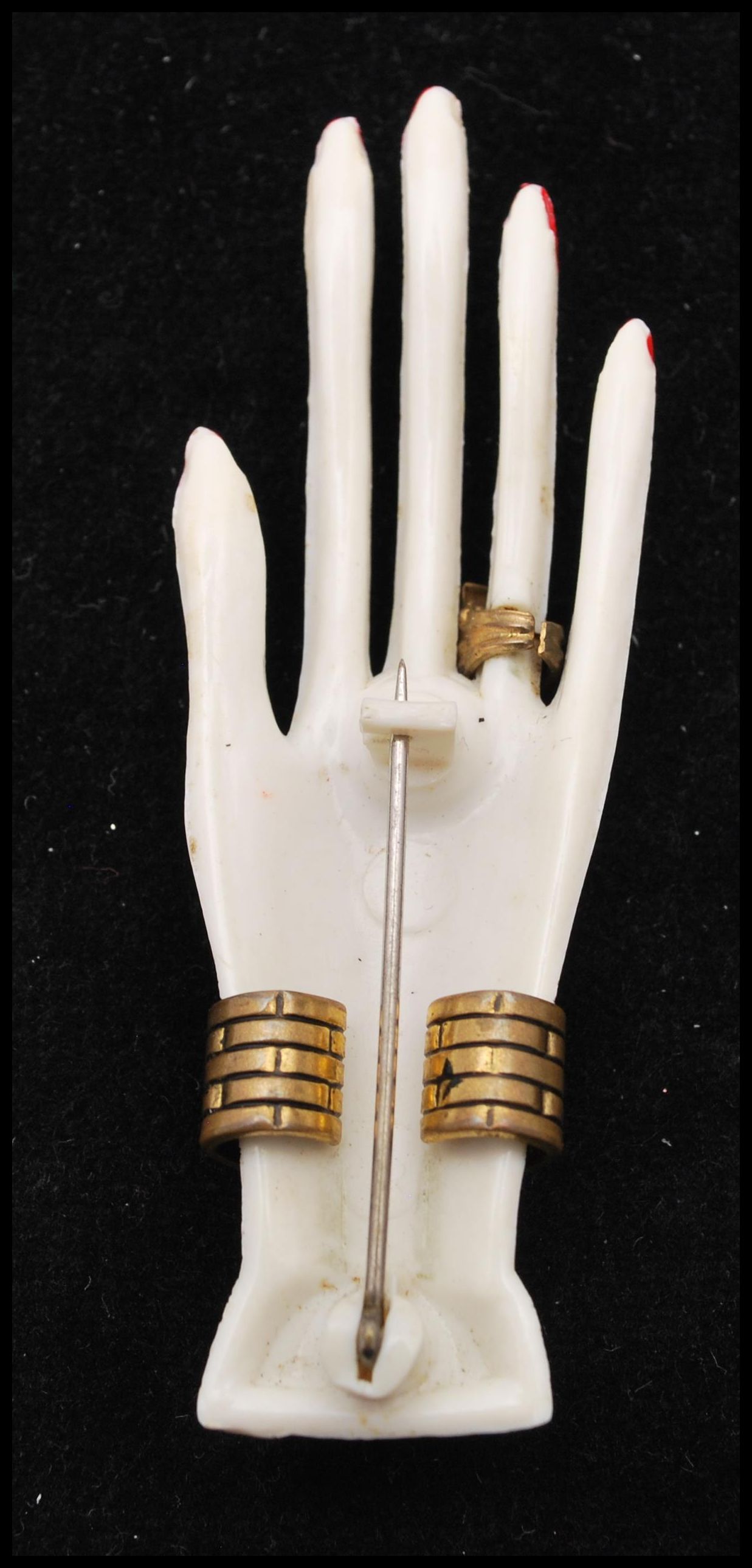 A 1930s Art Deco French celluloid brooch in the form of a graceful hand set with jewellery, paste - Image 2 of 3