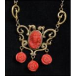 A 1930s Czech cameo necklace strung on a gold-tone chain having coral colour floral drops.