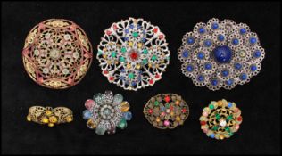 A collection of  1930s Czech brooches set with cabochons and rhinestones most in filigree designs. x