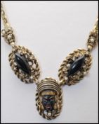 A 1950s Selro Selini black Asian princess necklace and brooch pin set decorated with thermoset