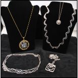 A collection of vintage necklace to include a gold-tone signed Trifari horoscope necklace Libra, A