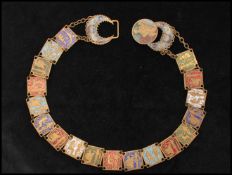 A 1930s Czech Neiger Egyptian revival metal belt having enamel decorated links. Measures 26 inches.