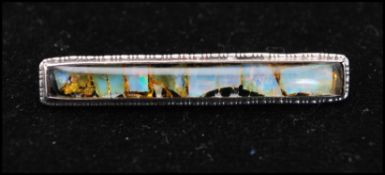 An early 20th century opal set bar brooch having a C clasp. Marked silver tests silver. Measures 2