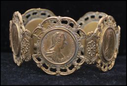 A 1960s signed Miriam Haskell coin bracelet having 5 coin links, coins marked M Theresia. D.G  R.