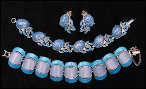 A 1950s silver-tone confetti lucite bracelet and earring set together with a thermoset bracelet.