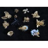 A collection of 12 vintage bug brooches to include signed Monet gold-tone Bee, Regency red