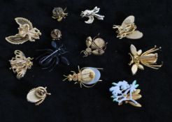 A collection of 12 vintage bug brooches to include signed Monet gold-tone Bee, Regency red