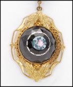 A 1930s Art Deco black glass cameo style necklace with painted pink rose. Measures 18inches, pendant