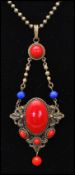 A 1930s Czech pendant necklace having red cabochons with red and blue faceted glass beads strung