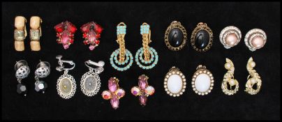 A collection of vintage gold and silver-tone earrings to include coloured and AB rhinestones, pearl,