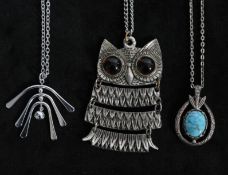 A collection of vintage 1970s silver-tone necklaces to include a large silver-tone owl pendant