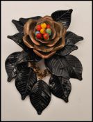 A 1940s early Miriam Haskell large dangle brooch having copper colour metal flower with coloured