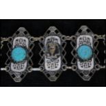 A vintage white metal Czech Egyptian revival bracelet with turquoise colour cabochons and pharaohs