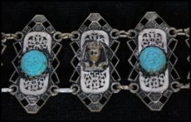 A vintage white metal Czech Egyptian revival bracelet with turquoise colour cabochons and pharaohs