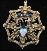 A 1940s Victorian revival gold tone necklace strung with large jewelled pendant. Measures 14