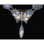 A 1950's damascene butterfly pendant drop necklace having twin strand chains with clip clasp.