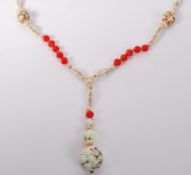 A 1920s Czech Neiger brother sautoir necklace with red and cream moulded glass beads with large