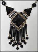 A 1930s Art Deco Czech black glass drop pendant necklace having a spring hoop clasp.