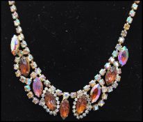 A 1950s Czech bronze AB rhinestone and moulded amber glass necklace. Measures 16 inches.