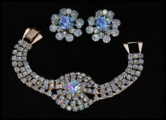 A 1960s silver-tone blue rhinestone set bracelet and earring set. Bracelet Measures approx 6