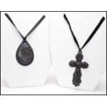 A Victorian large carved Jet crucifix together with a carved Jet cameo pendant. The crucifix being