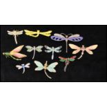 A collection of vintage dragonfly bug brooch pins to including rhinestone set, faux pearl, enamel,