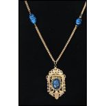 A 1940s signed Miriam Haskell gold tone blue and black art glass pendant necklace with patented