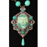 A 1930s Czech Neiger brothers Egyptian revival pendant necklace, having peaking glass and fretwork
