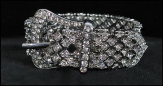 A good silver-tone mid 20th century rhinestone stretch bracelet in the form of a belt. Measures