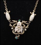 A 1950s signed Florenza figural necklace and bracelet set having Ivory thermoset Buddha with