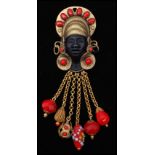 A vintage signed Askew of London figural brooch pin in the form of a blackamoor with beaded hair
