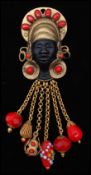 A vintage signed Askew of London figural brooch pin in the form of a blackamoor with beaded hair