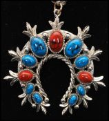 A 1960s signed Art © Arthur Pepper squash blossom necklace. Measures 24 inches plus 2 1/2 inch